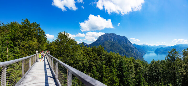 Elevated walkway on summit of Grunberg mountain with Traunsee lake in distant background