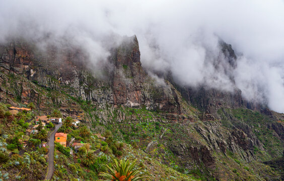 Spain, Province of Santa Cruz de Tenerife, Masca, Low clouds floating over secluded village in Macizo de Teno range