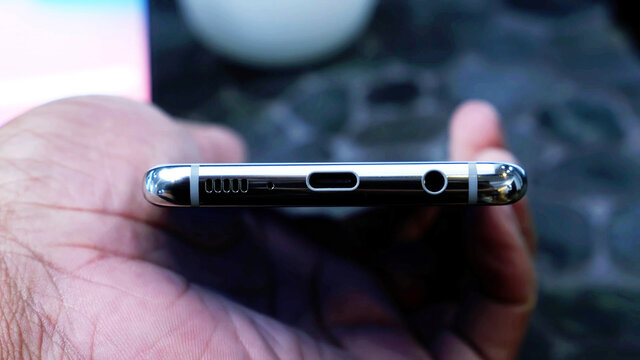Closeup, usb charging port, Prise jack, speakers, microphone, on the bottom of a smartphone
