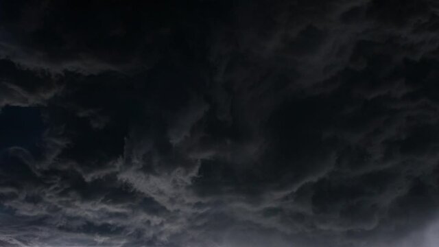 Lightning flashed inside the oncoming cumulus cloud, a thunderstorm