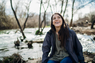 Young woman spending free time in national park/mountains.Hiking outdoor experience.Nature adventure.Woman appreciating nature and natural beauty.Activist.Environmental Protection and Sustainability