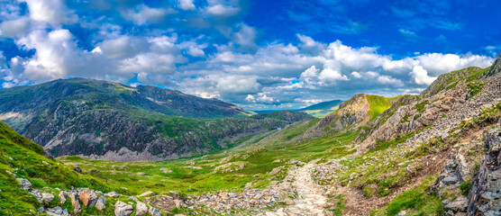 Naklejka na ściany i meble Beautiful landscape panorama of Snowdonia National Park in North Wales. UK