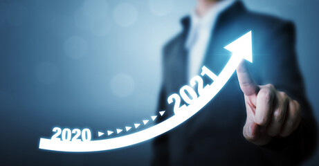 Businessman pointing arrow graph corporate future growth plan. Business development to success and...