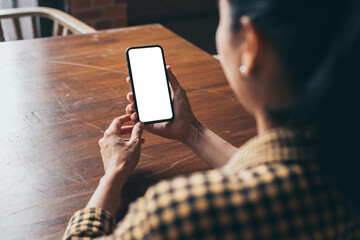 cell phone blank white screen mockup.woman hand holding texting using mobile on desk at office.background empty space for advertise.work people contact marketing business,technology