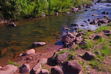 Clear water and rocks in small creek in the north of Thailand