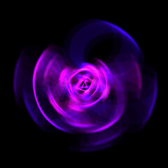 Spinning rays of light isolated on black background. Graphic 2D illustration of glowing colorful light particles in circular motion.