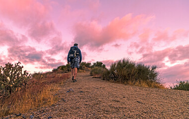 Man Hiking Up Desert Trail Early Morning