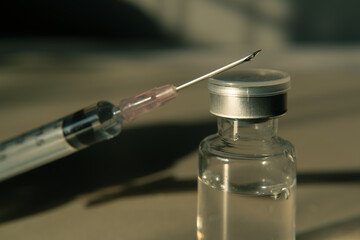 syringe with needle and vaccine vial