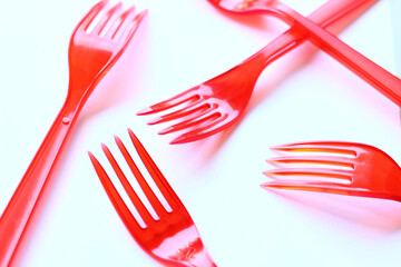 Red Plastic Fork On White Background