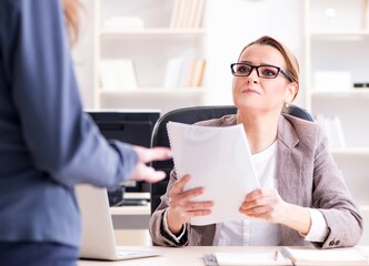 Angry boss dismissing employee for bad underperformance