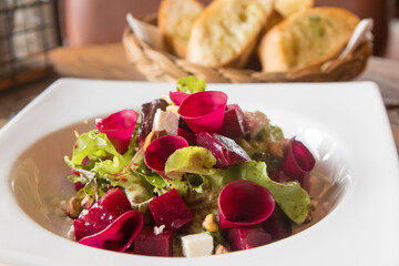 Beetroot feta salad.
Pickled beetroots, feta cheese, lettuce, roasted pistachios & herbs napped with a balsamic vinaigrette. 