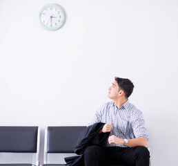 Man nervously impatiently waiting in the lobby