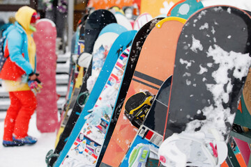 Snowboards stand in a row
