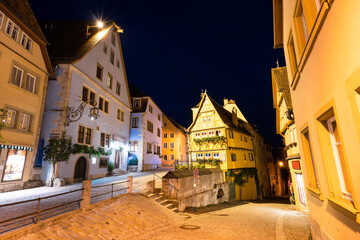 Fototapeta na wymiar Untere Schmiedgasse street at night. Rothenburg ob der Tauber. Germany