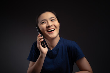 Asian woman happy surprised holding smart phone.