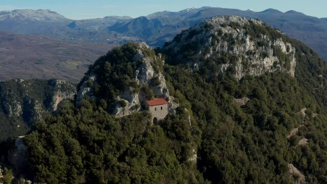 Aerial view around a hillside house on a mountain, sunny day, in Salerno, Italy - circling, drone shot