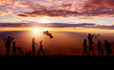 Fototapeta na wymiar Silhouette of family and sky sunset background
