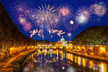 Fireworks display near Sant' Angelo Bridge and St. Peter's cathedral in Vatican City, Rome.Italy