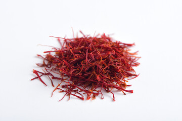 A close-up picture of saffron on a white background