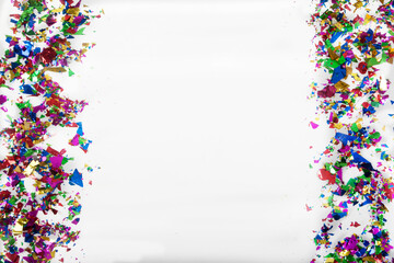 Christmas and New Year sparkles around the edges on a white background. Holiday concept. Copy space.