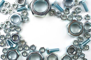 close-up of metal fasteners. bolts and nuts with free space