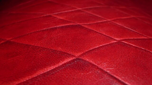 Real red leather texture very close up. Natural pattern. Fashion and clothing industry, shoes, bag, belt, coat and other leather accessories, Leather Upholstery Furniture