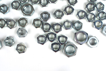 metal nuts of different sizes on a white background