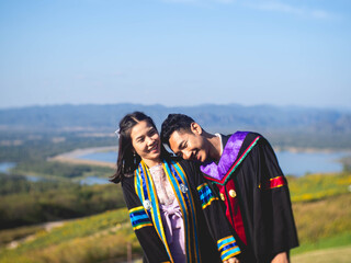 The graduate wore a gown from a university in Thailand. For graduation in 2020