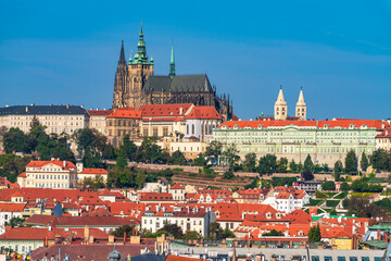 Obraz premium Top view of red roofs and Prague's castle in Czech republic