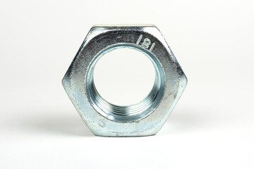 large nuts made of silver metal on a white background