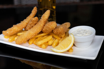 Dory dippers served with French fries, tartar sauce and lemon