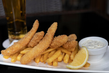 Dory dippers served with French fries, tartar sauce and lemon
