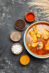 Vertical view of handmade soup with chicken and spices set