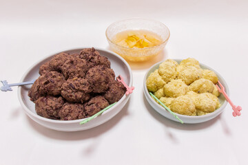 Rice cakes made with bean flour and mashed adzuki beans, Watery Kimchi (mulgimchi, mulkimchi), Korean traditional food, dessert, Injeolmi, tteok, homemade food.