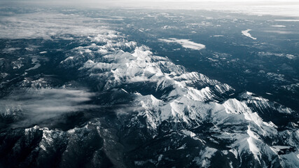 aerial view of mountains in the snow