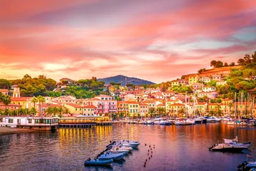 Fotobehang Harbor and village  Porto Azzurro at sunset, Elba islands, Tuscany, Italy. © Serenity-H