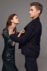 Aggressive woman indignant look at men problems in family conflict