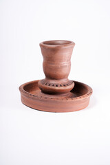 ceramic product with your own hands, made on a Potter's wheel, isolated on a white background