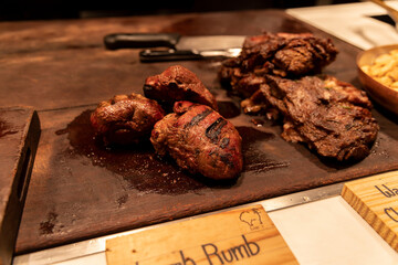 Lamb rump steak on wooden board