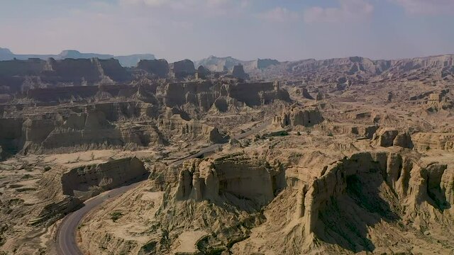 DJI Mavic 2 Pro Drone shot Empty road in Pakistan in Hingol area. Looks like surface of mars or another world.