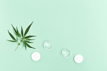 Cannabis beauty products that contain natural ingredients of plant origin. Jar of hemp eye serum...