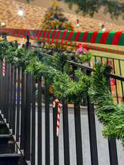 Vertical photo of stairs decorated with Christmas decoration