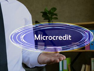  Financial concept meaning Microcredit with phrase on the page.