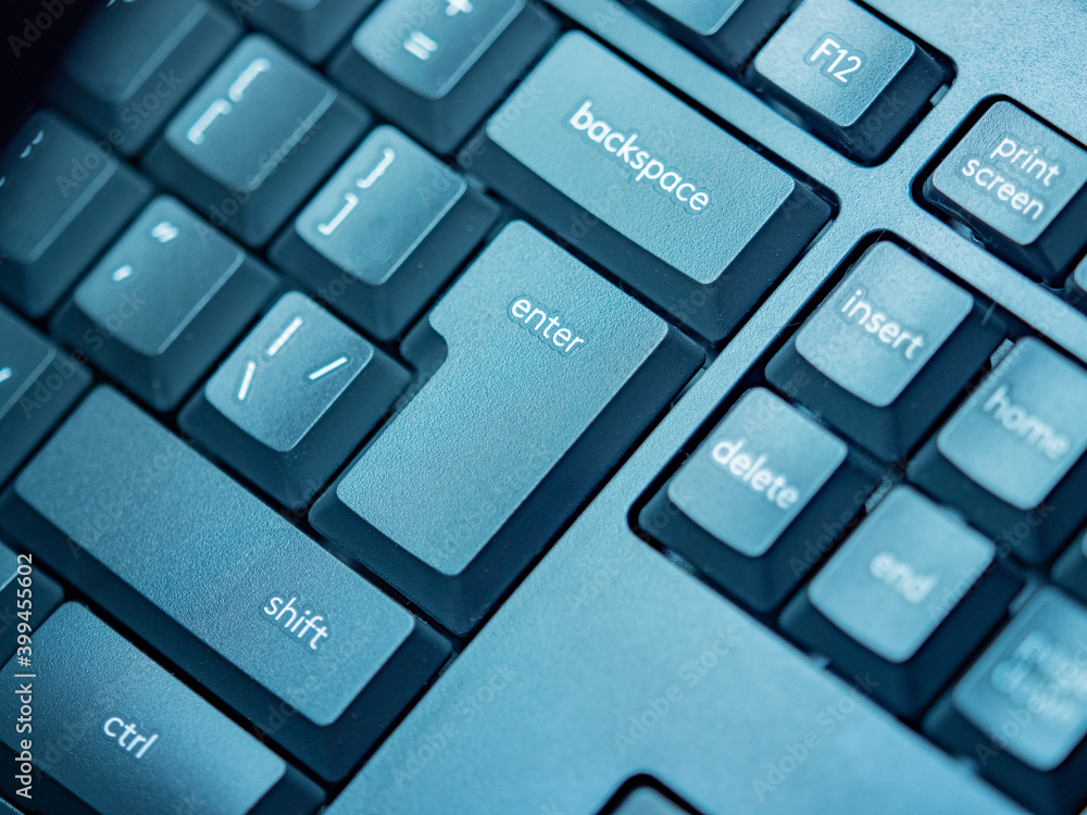 Poster buttons on a computer keyboard close-up. the black keyboard lies diagonally. the computer control ke