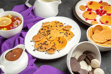 front view yummy little pancakes with choco cookies on dark desk dessert sweet cake