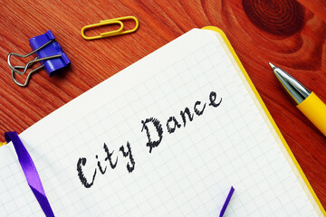 Financial concept about City Dance  with inscription on the sheet.