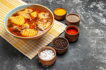 Side view of meal for dinner with chicken and spices