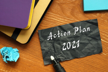 Financial concept meaning Action Plan 2021 with sign on the page.