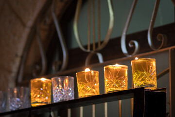 A large menorah with glass cups filled with olive oil in the Old Jewish Quarter of Jerusalem,...