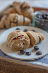 home made croissant filled with chocolate on a plate